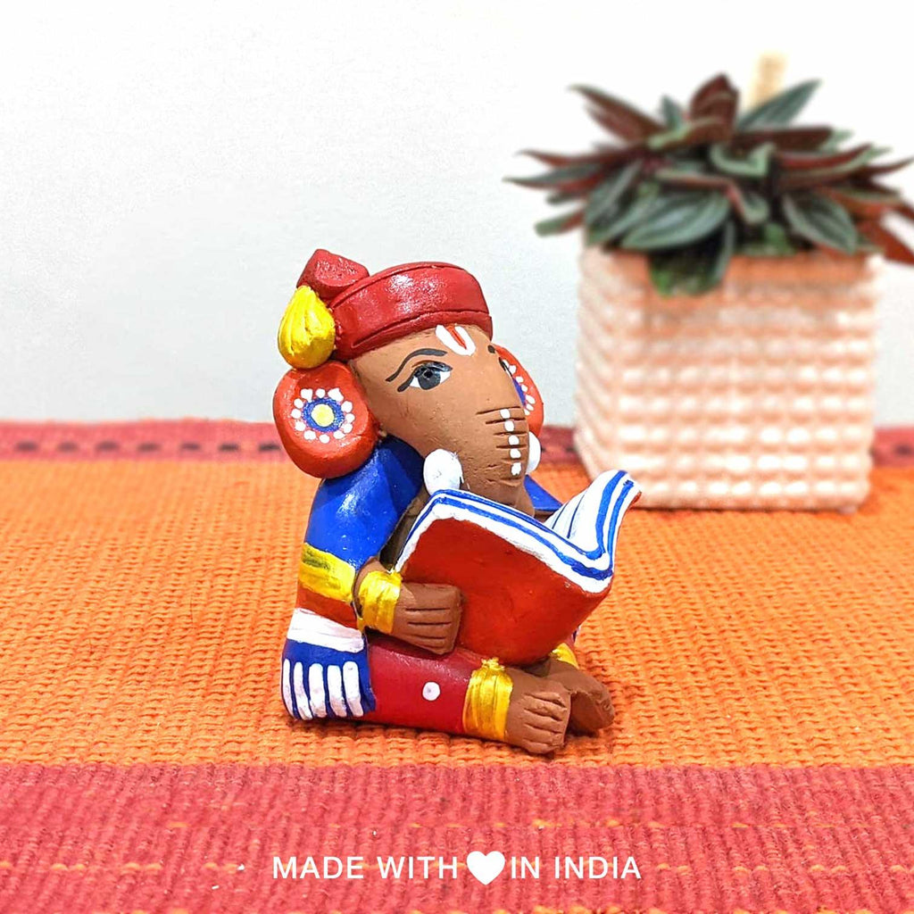 Buddhi Priya — Handpainted Terracotta Ganesha Reading a Tome - Made with Love in India