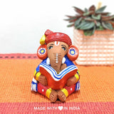 Buddhi Priya — Handpainted Terracotta Ganesha Reading a Tome - Made with Love in India
