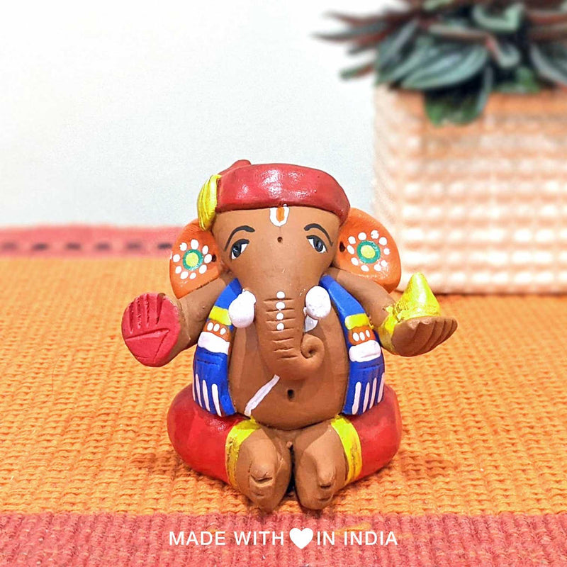 Modakapriya — Terracotta Ganesha Statue with a Modak - Made with Love in India
