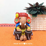 Nadaprati — Handpainted Terracotta Ganesha Statue Playing Tabla