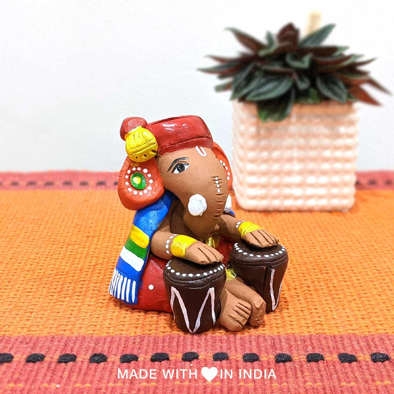 Nadaprati — Handpainted Terracotta Ganesha Statue Playing Tabla - Made with Love in India